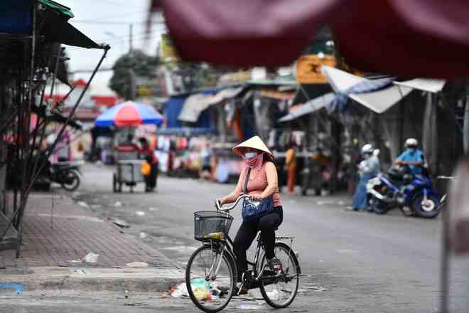 Người bán cơm trước cổng Bệnh viện Nhi đồng 1 nhiễm nCoV